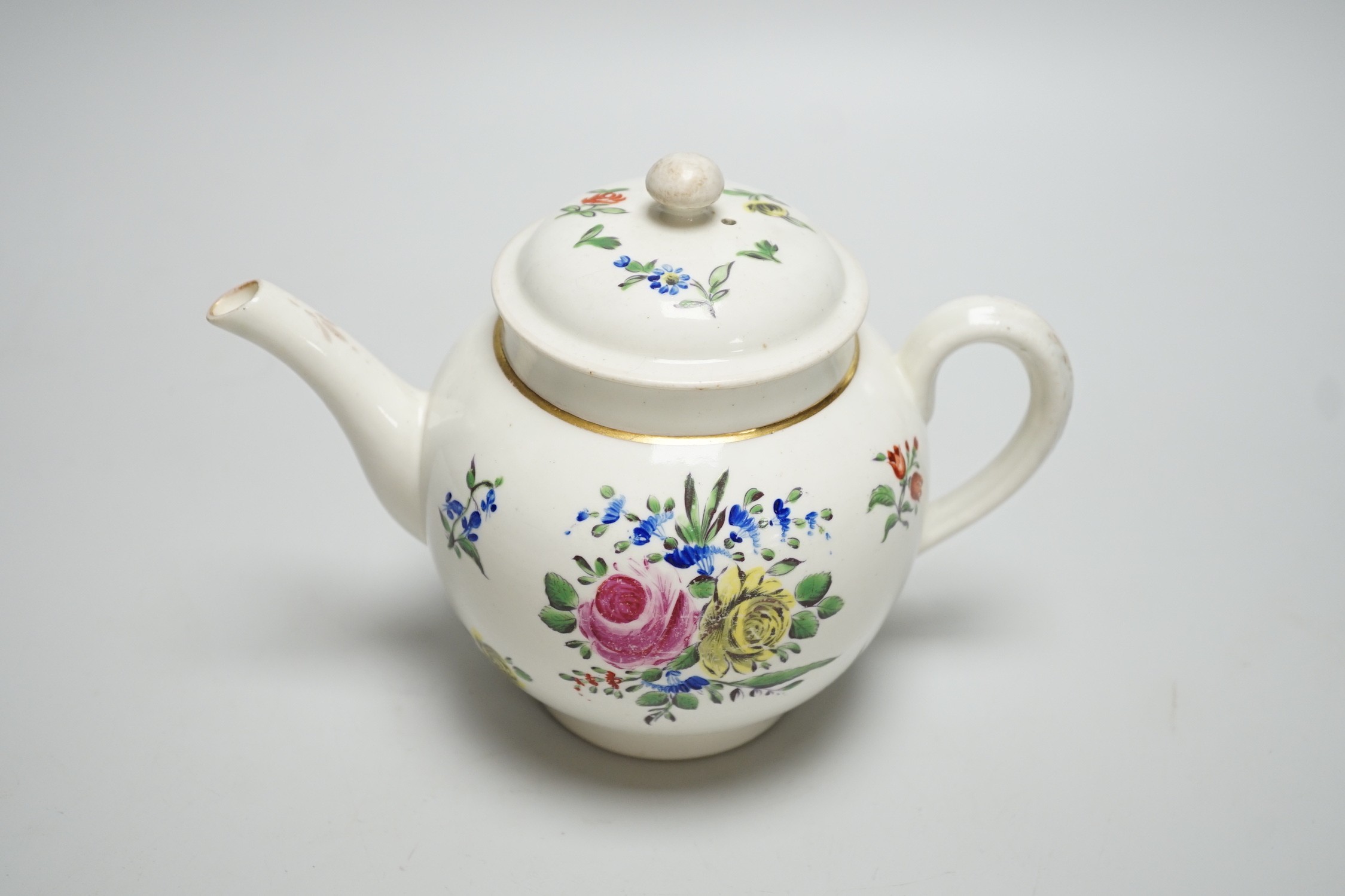 An 18th century Caughley teapot and cover with back to back roses, 15cms high